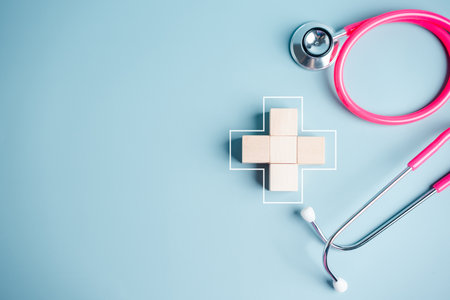 Health insurance concept. people hands putting plus symbol and healthcare medical wooden cube block with icon, health and access to welfare health conceptの写真素材