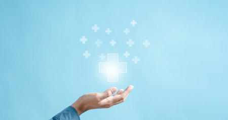Health insurance concept. people hands holding virtual plus and healthcare medical icon, health and access to welfare health concept.の写真素材