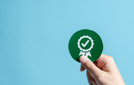 Business hand with sign of the top service Quality assurance, leading services ISO Certification, quality, guarantee, Standards, ISO, standardization. QA and Quality Control or QC and improvement.の写真素材