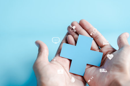 Health insurance concept. people hand holding plus and healthcare medical icon, health and access to welfare health concept.の写真素材