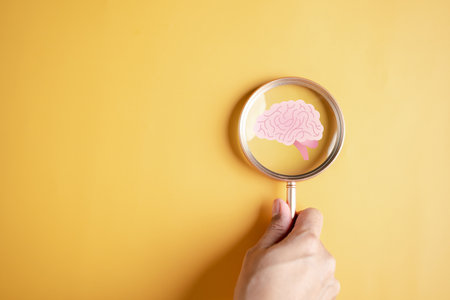 Magnifier focus to human brain icon, idea creative intelligence thinking or Awareness of Alzheimer, Parkinson's disease, dementia, stroke, seizure or mental health. Neurology and Psychology care.の写真素材