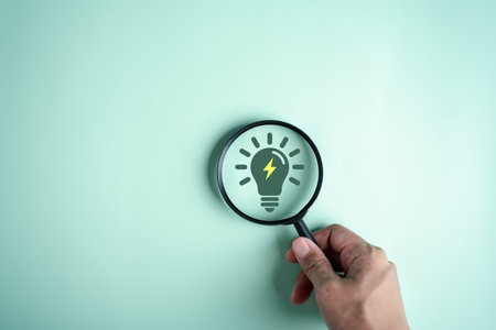 Magnifier focus to green electricity icon decrease CO2 or carbon dioxide emission, carbon footprint and carbon credit to limit global from climate change, Earth for develop green energyの写真素材