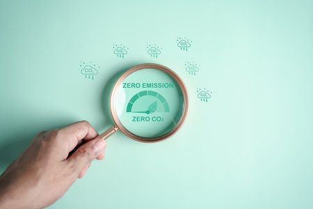 Magnifier focus to CO2 reduction icon on global earth decrease CO2 or carbon dioxide emission, carbon footprint and carbon credit to limit global from climate change, Earth for develop green energyの写真素材