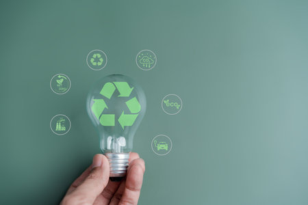 Recycle icon on lightbulb earth decrease CO2 or carbon dioxide emission, carbon footprint and carbon credit to limit global from climate change, Earth for develop green energyの写真素材