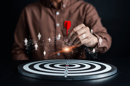 Customer Targeting the business concept, Businessman aiming red arrow dart to the target dartboard, Executive marketing, investment goal and target for planning development customer target group.の写真素材