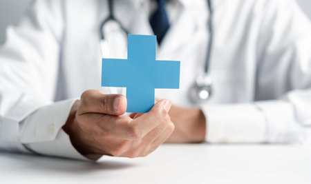Doctor in white coat holding plus sign for assurance healthcare insurance symbol concept, Mental health care, medical check up concept.の写真素材