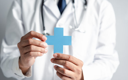 Doctor in white coat holding plus sign for assurance healthcare insurance symbol concept, Mental health care, medical check up concept.の写真素材