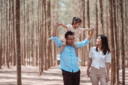 Happy family in the nature travel. family on weekend playing together in the forest.の写真素材