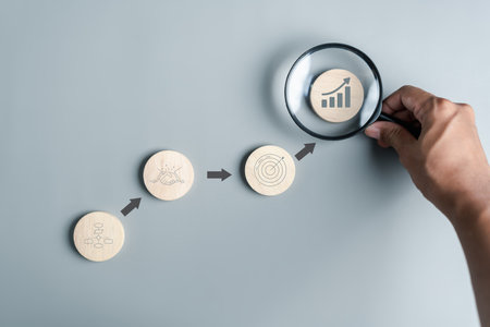 Hand holding magnifier to analysis portfolio management of money investing icon for planning development leadership and customer target group concept.の写真素材