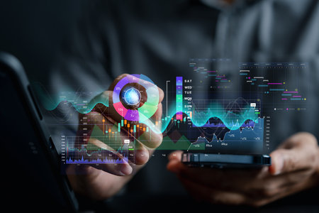 Analyst working with computer in Business Analytics and Data Management System to make report with...