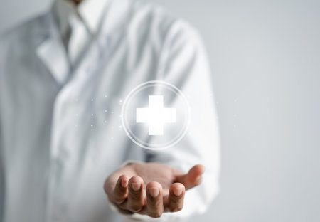Health insurance concept. Doctor in a white coat uniform hand holding plus and healthcare medical icon, health and access to welfare health concept.の写真素材