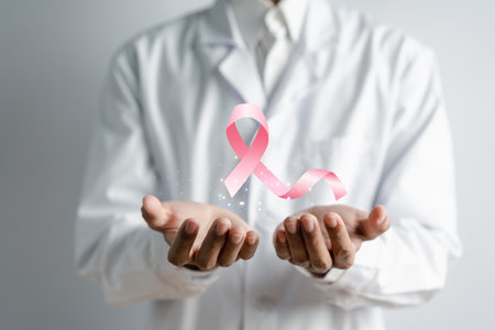 Doctor holding virtual pink ribbon cancer, Breast cancer awareness and health care medical check-up concept.の写真素材