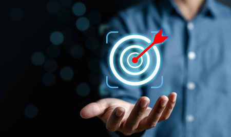 Businessman holding business target objective virtual icon, planning development leadership and customer target group, investment growth and success development, achievement, goal, strategy, finance.の写真素材