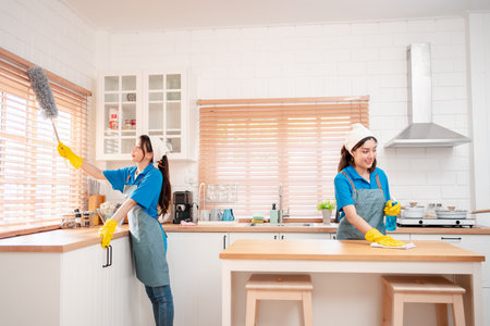 Housework or house keeping service female cleaning dust in house, cleaning agency small business. professional equipment cleaning old home.の写真素材