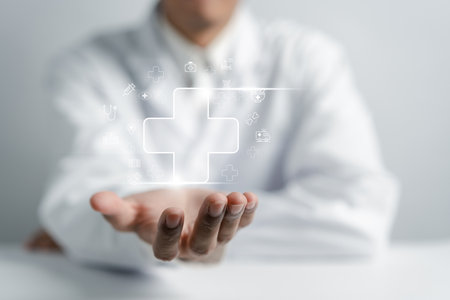 Doctor holding plus sign for treatment hospital and clinic service or healthcare insurance symbol concept, Mental health care and medical concept.の写真素材