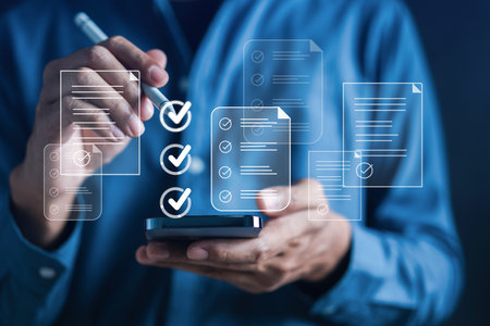 Online survey filling out and digital form checklist by laptop computer, Document Management Checking System, online documentation database and process manage files.の写真素材