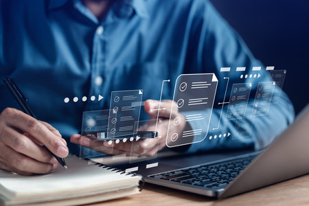 Online survey filling out and digital form checklist by laptop computer, Document Management Checking System, online documentation database and process manage files.の写真素材