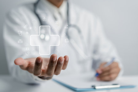 Doctor holding plus sign for treatment hospital and clinic service or healthcare insurance symbol concept, Mental health care and medical concept.の写真素材