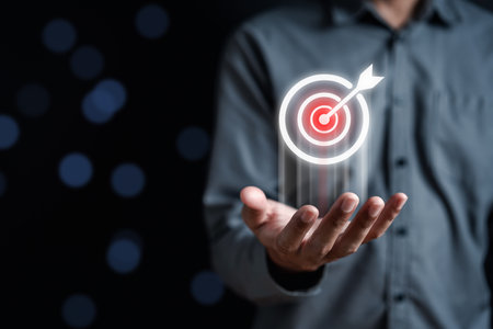 Businessman hold virtual target icon and planning development leadership and customer target group management in corporate growth business.の写真素材