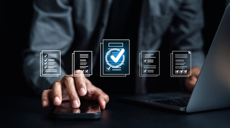 Online survey filling out and digital form checklist by laptop computer, Document Management Checking System, online documentation database and process manage files.の写真素材