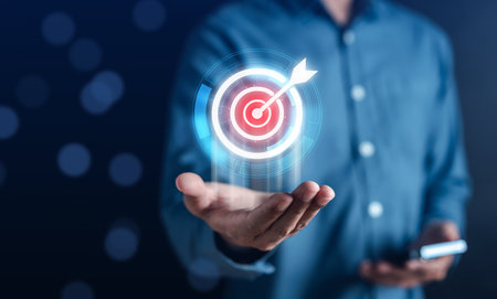 Businessman hold virtual target icon and planning development leadership and customer target group management in corporate growth business.の写真素材