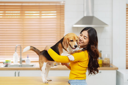 Happy asian woman enjoying her dog pet in the home, Friendship pet and human lifestyle concept.の写真素材