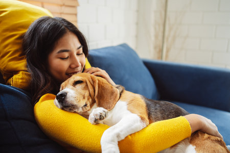 Happy asian woman enjoying her dog pet in the home, Friendship pet and human lifestyle concept.の写真素材