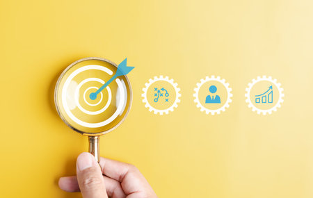 Magnifier glass focus to target icon which for planning development leadership and customer target group concept.の写真素材