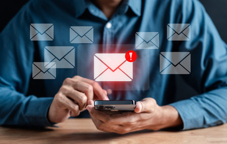 Alert Email inbox and spam virus with warning caution for notification on internet letter security protect, junk and trash mail and compromised information.の写真素材