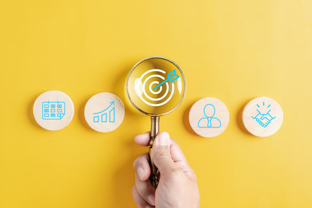Magnifier glass focus to target icon which for planning development leadership and customer target group concept.の写真素材