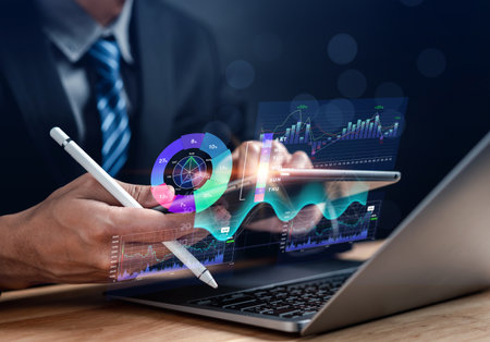 Analysis working in Business Analytics and Data chart process with Laptop Computer to database. Corporate and Business strategy for finance, operations, sales, marketing, Online planning workflow.の写真素材