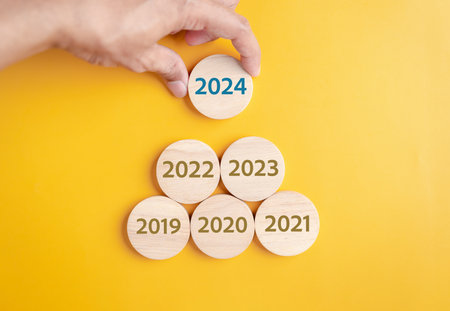 Planning New year in 2024. putting wood block to countdown merry christmas and happy new year, Planning and challenge strategy in new year 2024 Conceptの写真素材