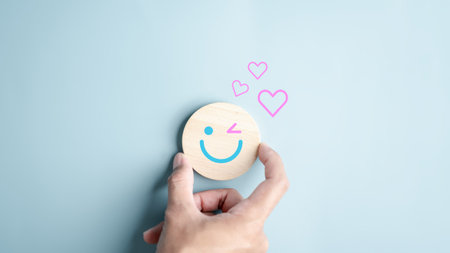 Hands holding blue happy smile face. mental health positive thinking and growth mindset, mental health care recovery to happiness emotion.の写真素材