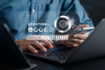 Update software and installing new version system in computer. Man upgrade program, Business technology internet loading bar with installing the update for the quality better.の写真素材