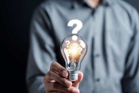 Businessman hand holding light bulb with brain into smart, creative, idea thinking to innovation brainstorm and imagination learning educate concept.の写真素材