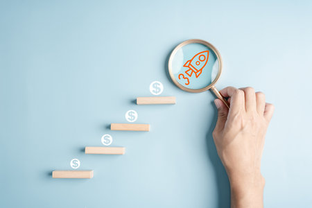Business growth success achievement concept, hand of people arranging as step stair or ladder rocketship launch for planning development leadership and customer target group concept.の写真素材