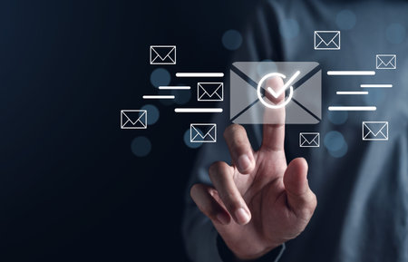 Businessman sending email by laptop computer to customer, business contact and communication, email icon, email marketing concept, send e-mail or newsletter, online working internet network.の写真素材