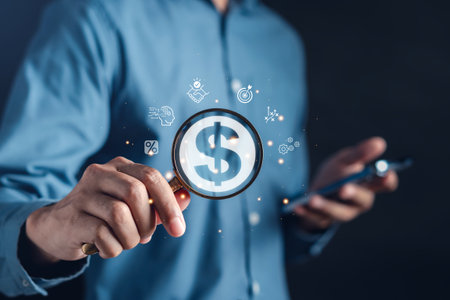 Make money dollar with online technology concept. Man holding magnifier for searching online marketing on network businessの写真素材