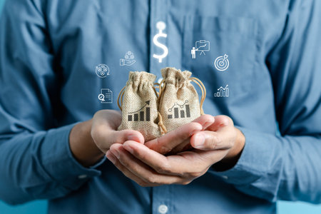 Man holding money bag, Planning investment, insurance, management business and saving money.の写真素材