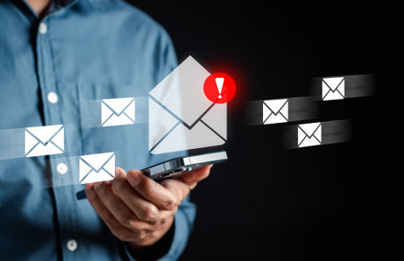 Alert Email inbox and spam virus with warning caution for notification on internet letter security protect, junk and trash mail and compromised information.の写真素材
