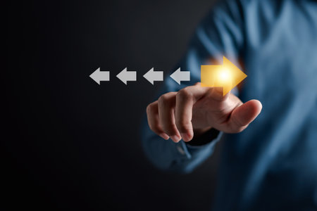 Point to orange arrow and different direction facing opposite direction with white arrow for business disruption and technology transformation and different thinking idea concept.の写真素材