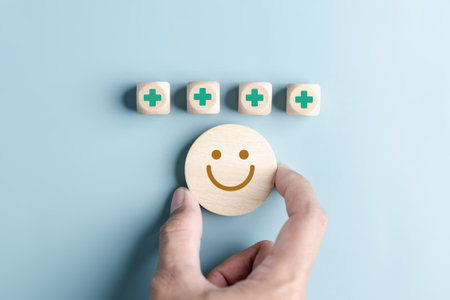 Happy smile face with plus sign, mental health positive thinking and growth mindset, mental health care recovery to happiness emotion.の写真素材