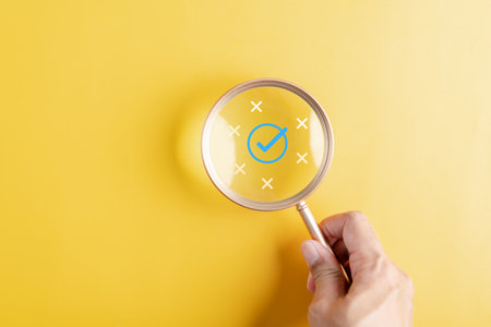 Magnifier focus to correct icon which among wrong icon on wooden block for document and project approve, check, mark.の写真素材
