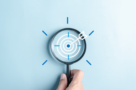 Magnifier glass focus to target objective with idea creative light bulb icon. planning development leadership and customer target group concept.の写真素材