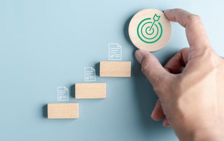 Business growth success achievement concept, hand arranging stack as step stair or ladder for planning development leadership and customer target group concept.の写真素材