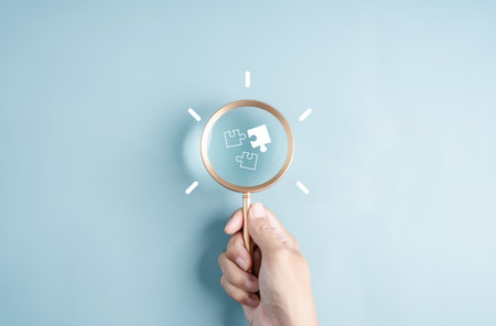 Magnifier glass focus to jigsaw with idea creative light bulb icon. planning development leadership and customer target group conceptの写真素材