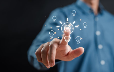 Hand man holding illuminated lightbulb, idea, innovation and inspiration, smart business intelligent creativity with bulbs, Motivation and innovation concept.の写真素材