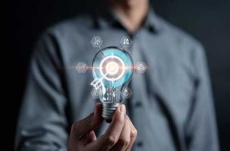 Hand man holding illuminated lightbulb, idea, innovation and inspiration, smart business intelligent creativity with bulbs, Motivation and innovation concept.の写真素材
