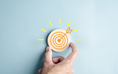 Hand holding to target objective with idea creative light bulb icon. planning development leadership...