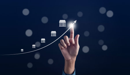 Hand Pointing arrow of Owner business commerce online startup profit earning and goal successful franchise store. Future best product and store and competent systemの写真素材